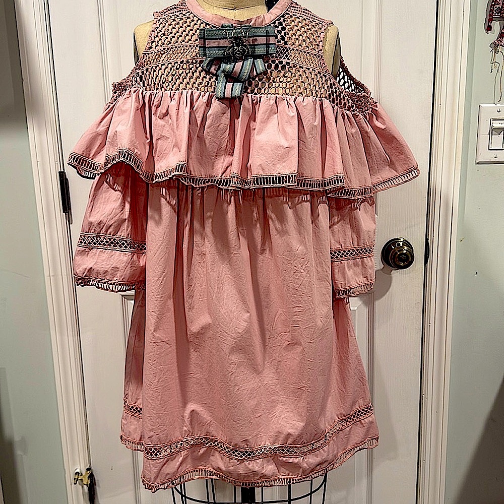 NWT Dress in pink color with ruffles. Detachable  bow pendant.